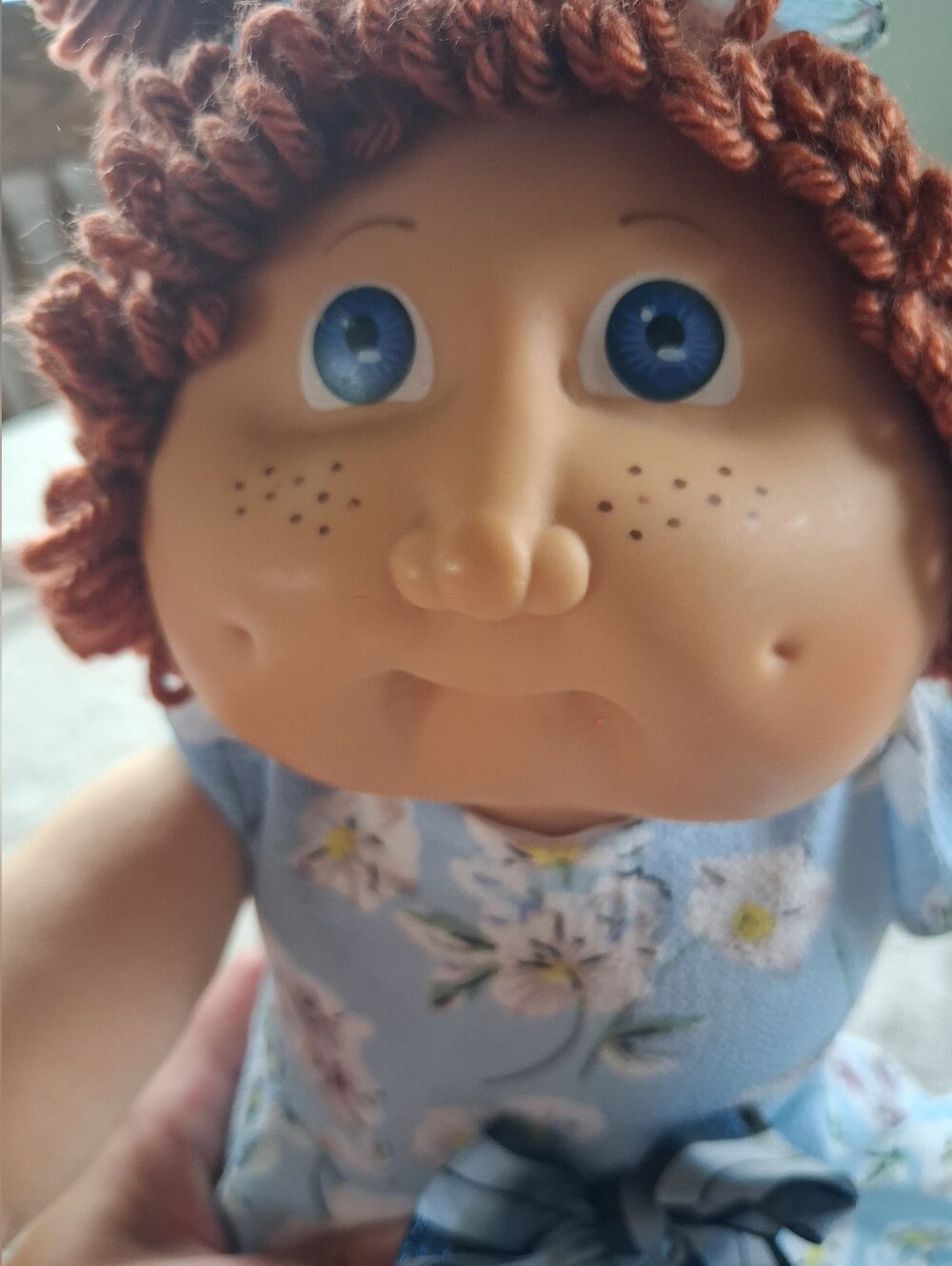 Plush Baby Doll with Blue Floral Dress and Curly Red Hair